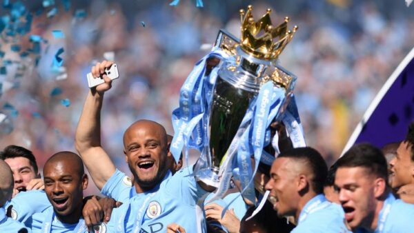 Kompany lifts the Premier League title for the fourth time during his City career