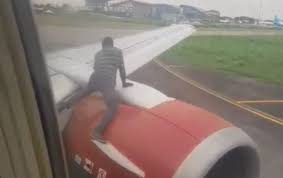 Man Climbs Aircraft