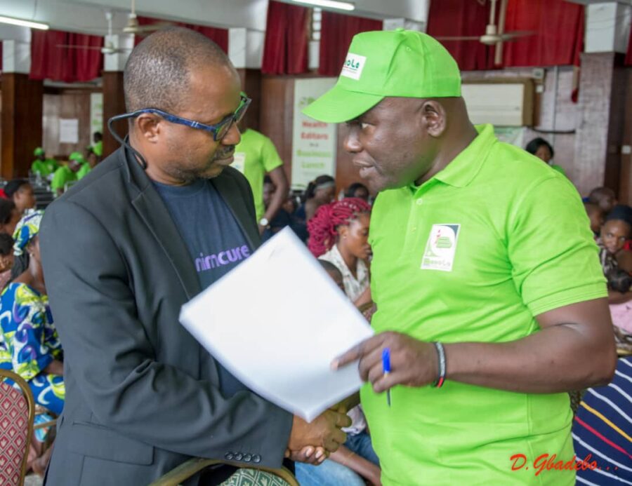 Dr Sam Amoo, Research Fellow, Centre for Human Virology and Genomics Research of the Nigeria Institute of Medical Research (NIMR) at the event (left) with Mr Olalekan Akinruli, COO Infotrust Multi-Media Concept Int. Ltd at the event