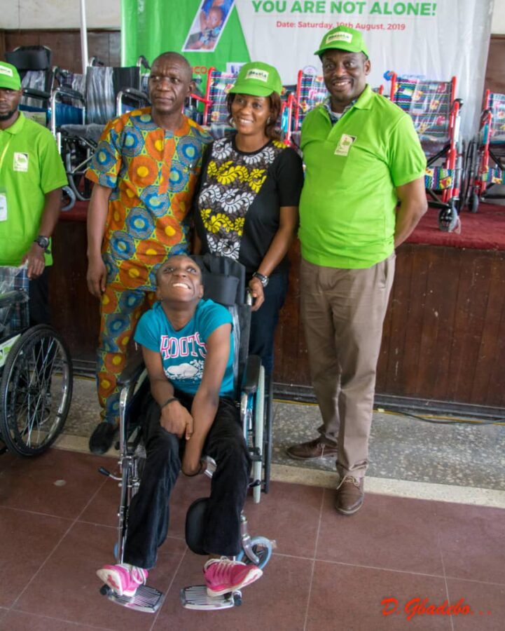 Professor Afolabi Lesi, Provost, College of Medicine, University of Lagos and Chairman Benola's Program Planning and Implementation Team (PPIT) and Founder Benola Cerebral Palsy Initiative, AVM Femi Gbadebo with a happy family after receiving their CP Wheelchair