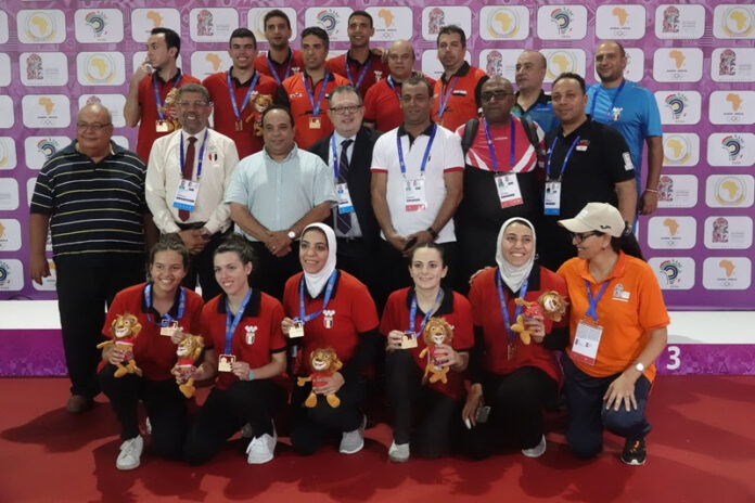 The victoriuos Egyptian men and women teams after their triumph over Nigeria at the 12th African Games in Rabat, Morocco on Friday August 23, 2019. The victoriuos Egyptian men and women teams after their triumph over Nigeria at the 12th African Games in Rabat, Morocco on Friday August 23, 2019..