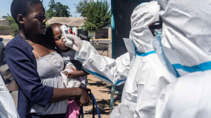 Medical personnel check temperatures of patients visiting Mpilo Hospital in Bulawayo, Zimbabwe, on April 25, 2020. PHOTO | ZINYANGE AUNTONY | AFP Medical personnel check temperatures of patients visiting Mpilo Hospital in Bulawayo, Zimbabwe, on April 25, 2020. PHOTO | ZINYANGE AUNTONY | AFP