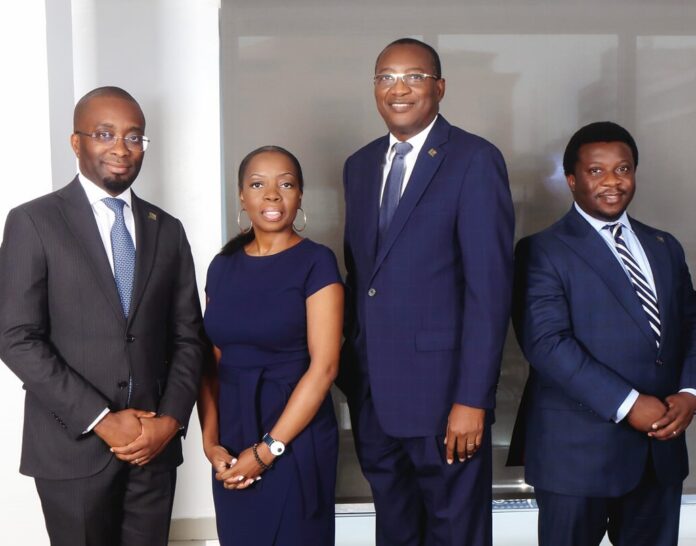 L-R: Mobolaji Adewumi, Executive Director, Finance and Admin; Lolita Ejiofor, GM, Group Head, IT & Resources; Madu Hamman, MD/CEO; Oladipupo Adeoye, Executive Director, Treasury, Operations & Construction Finance. L-R: Mobolaji Adewumi, Executive Director, Finance and Admin; Lolita Ejiofor, GM, Group Head, IT & Resources; Madu Hamman, MD/CEO; Oladipupo Adeoye, Executive Director, Treasury, Operations & Construction Finance.