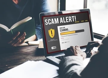 scam-alert-notification-laptop-concept