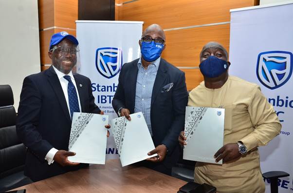 Demola Sogunle, CE Stanbic IBTC Holdings PLC; Amaju Pinnick, President, Nigerian Football Federation and Bukola Olopade, Sports Consultant, Nigerian Football Federation at the signing ceremony between Stanbic IBTC and NFF in Lagos. Demola Sogunle, CE Stanbic IBTC Holdings PLC; Amaju Pinnick, President, Nigerian Football Federation and Bukola Olopade, Sports Consultant, Nigerian Football Federation at the signing ceremony between Stanbic IBTC and NFF in Lagos.