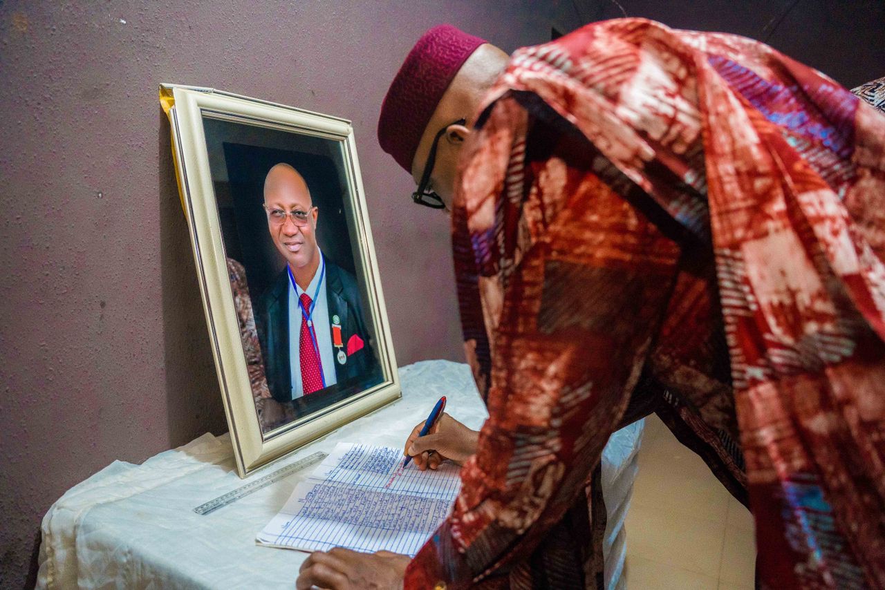 Abiodun signing the condolence register