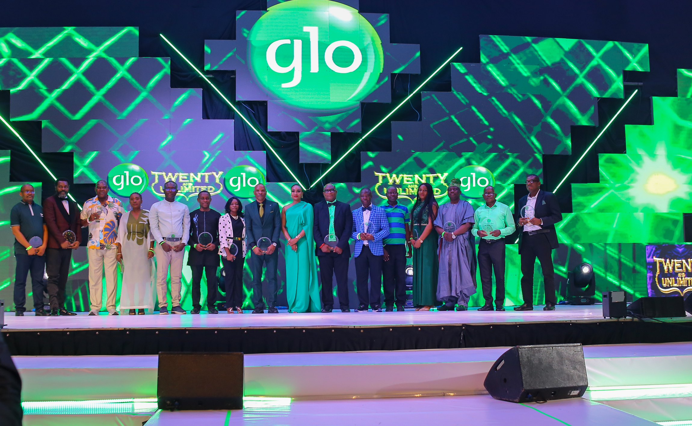 Executive Vice Chairman of Globacom, Mrs. Bella Disu (9th from left) with some of the 89 staff members of Globacom who were rewarded with millions of naira for working for the company for up to 20 years at the Glo Staff Party held at Eko Hotel & Suites in Lagos on Saturday night