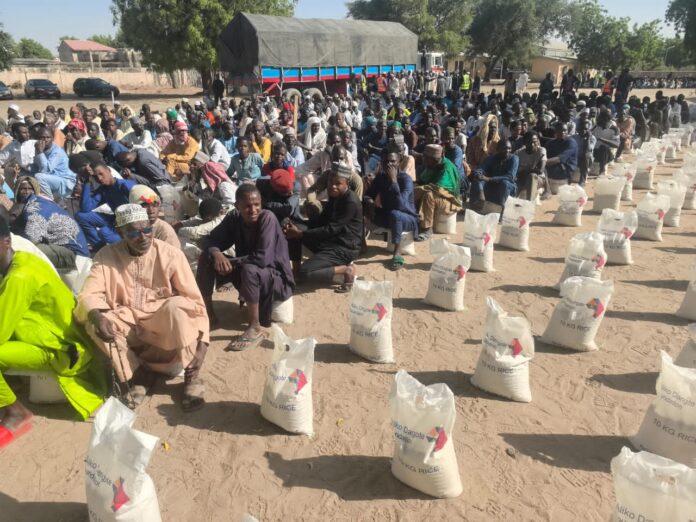 Beneficiaries receiving the Dangote Foundation Food Intervention in Borno state.